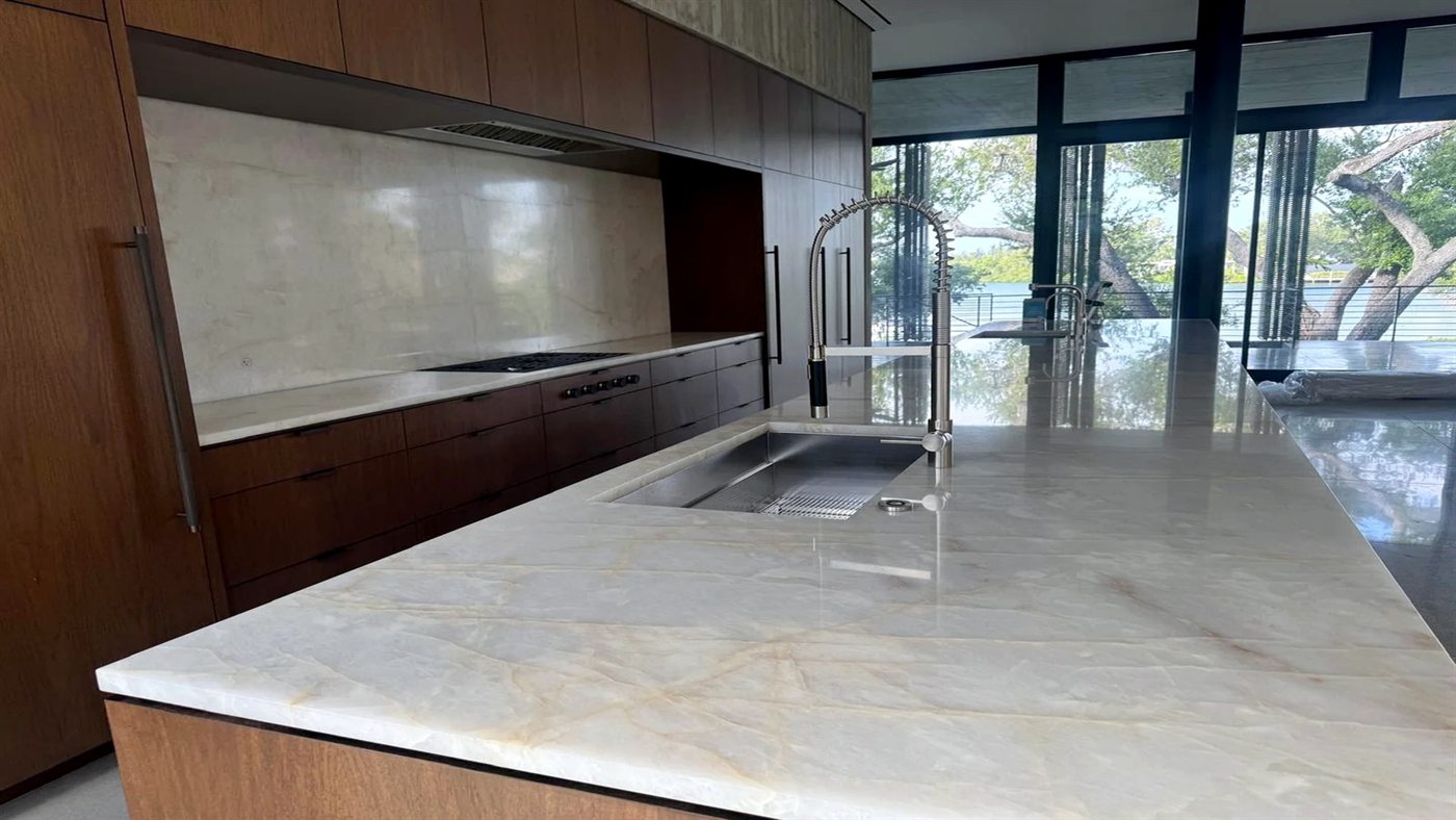 Empty kitchen with spotless countertops and clean cabinets, ready for handover