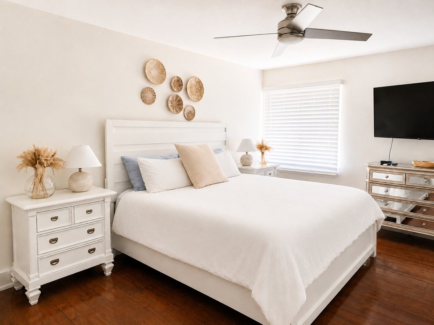 Freshly cleaned bedroom with made bed, dusted surfaces, and clean floors